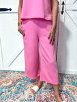 Model wearing bubblegum pink textured cropped lounge pants