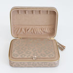 Photo of the inside of our jewelry organizer in the leopard print. Comes with a small pouch in the same color.
