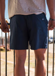 Photo of the backside of our navy shorts  with back pocket on the right side