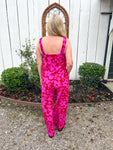 Woman modeling the back of this matching set with a tank top and pants