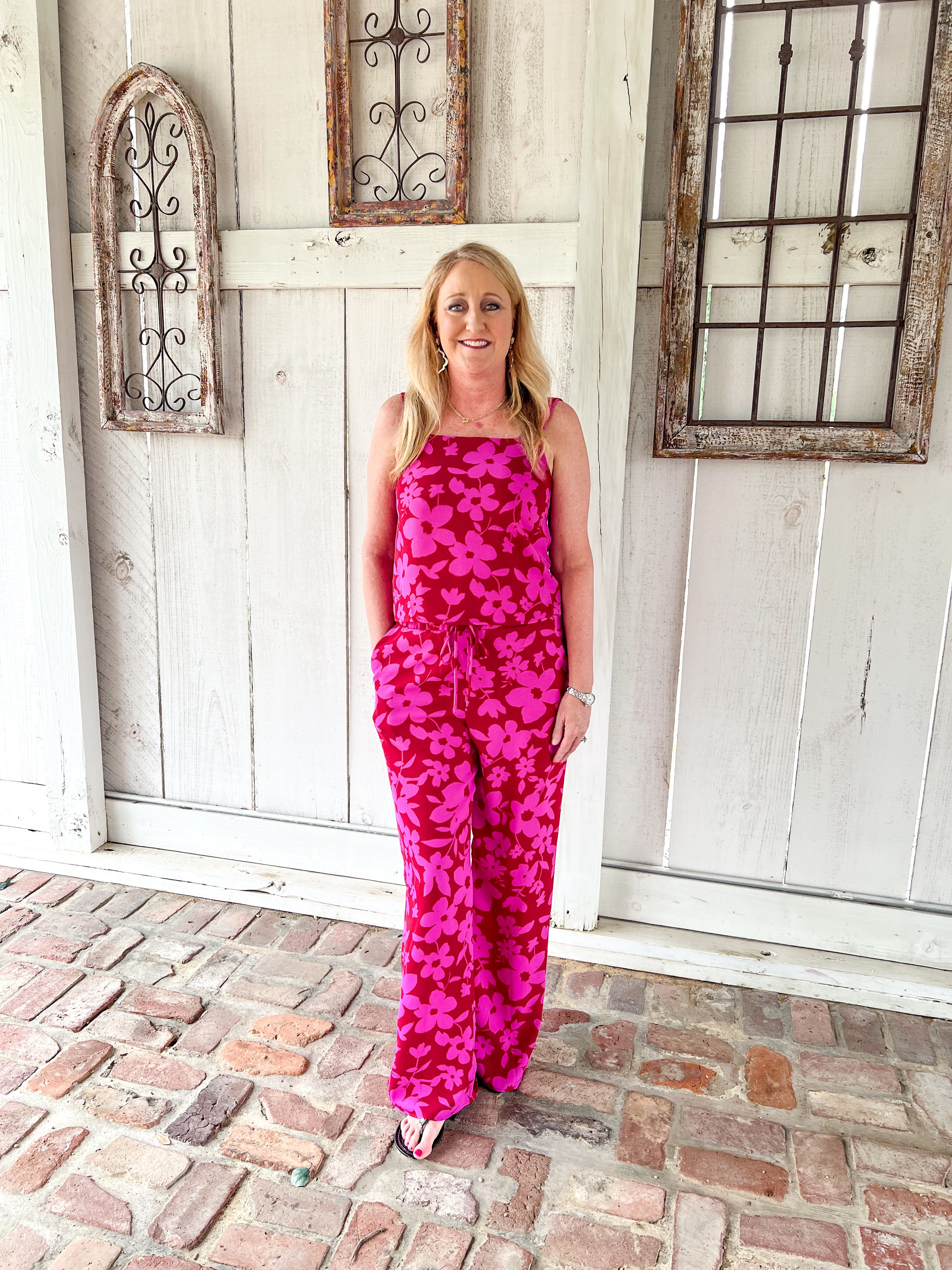 A full photo of this matching pants set in red with magenta flowers all over