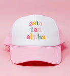 Photo of a sorority embroidered trucker hat with a light pink brim and mesh backing with your sorority's name in a light & dark pink, orange and green