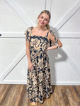 Black and beige floral print maxi dress that ties at the shoulders 