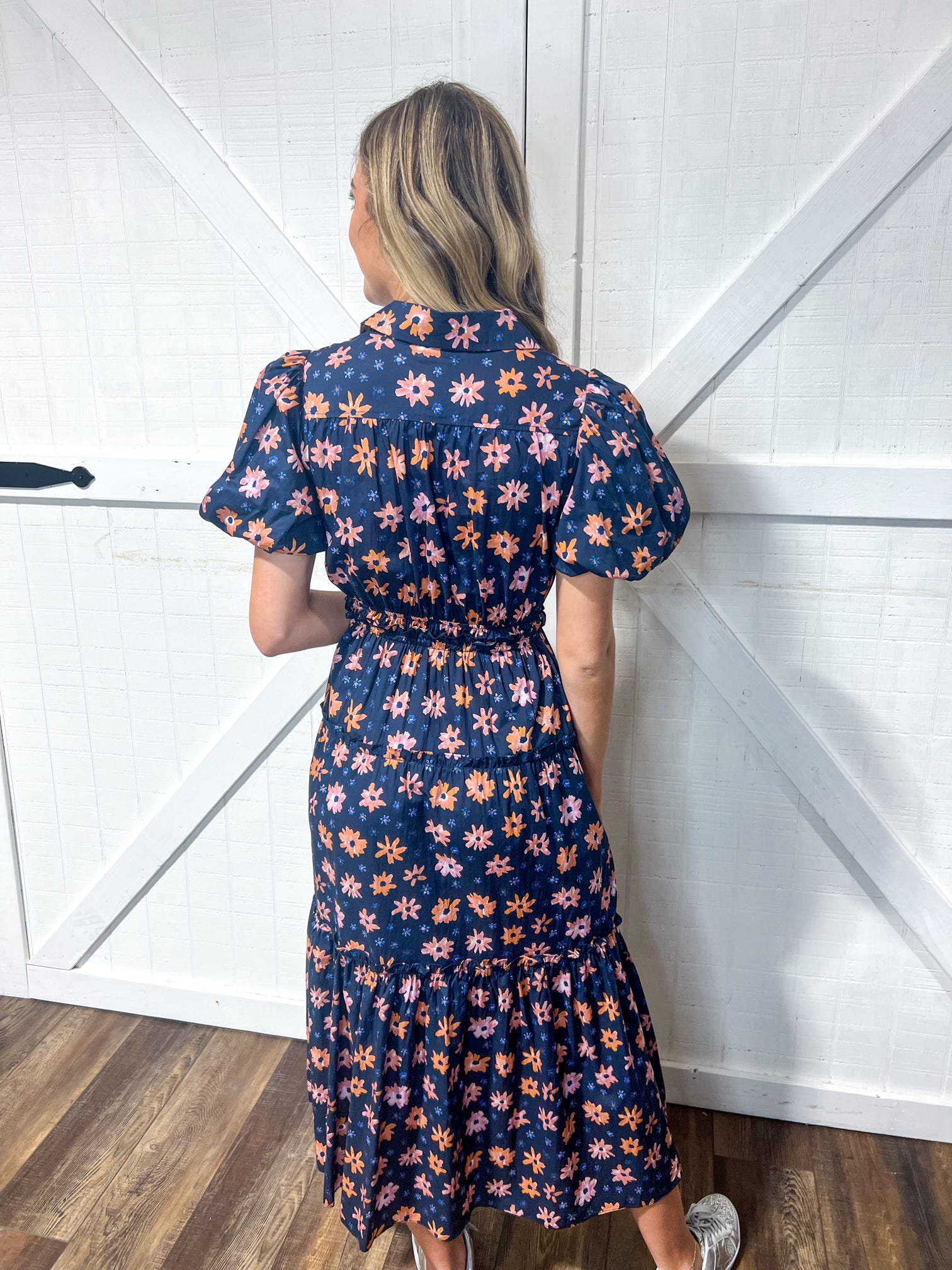 Photo of the back of the navy floral dress