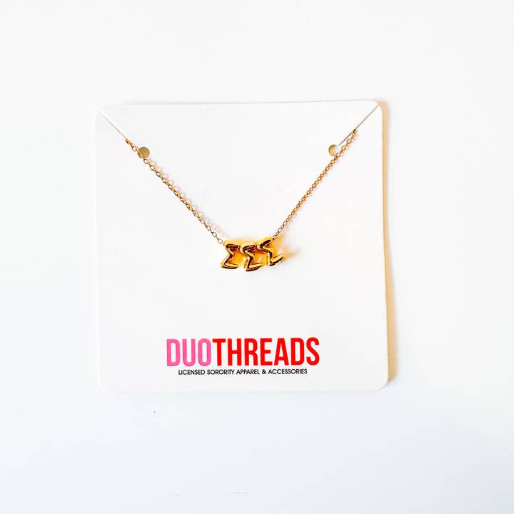A gold chain necklace with a 3D metallic 'EEE' pendant, displayed on a white card with the brand name 'DUOTHREADS' printed in red and black.