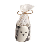 A ghost-shaped toothpick holder in a clear bag with twine on a white background