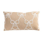 Beige pillow with white bow pattern on a beige background