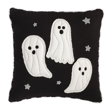 Black pillow with white ghost designs and star patterns on a white background