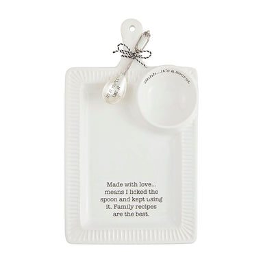 White ceramic platter with spoon and bowl, featuring humorous text, on a white background.
