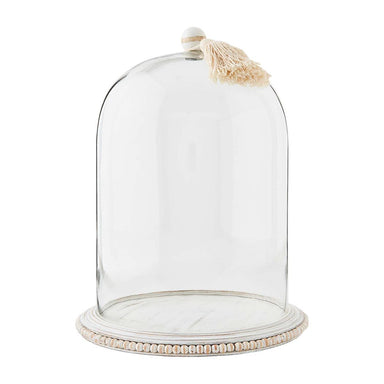 Photo of a large cloche featuring a white mango wood top handle with tassel and beaded white mango wood base