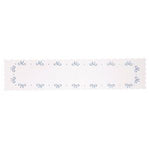 A cotton table runner featuring a scalloped edge and embroidered with light blue bows