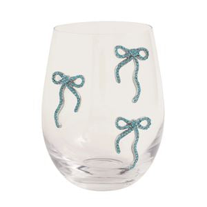 Clear glass with blue decorative bows on a white background