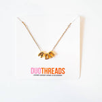 Gold necklace with 'ADPi' letters on a white background with 'DUO THREADS' branding.