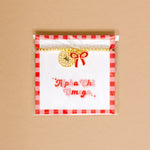 Gold bead bracelet with Alpha Chi Omega charm and a red bow charm