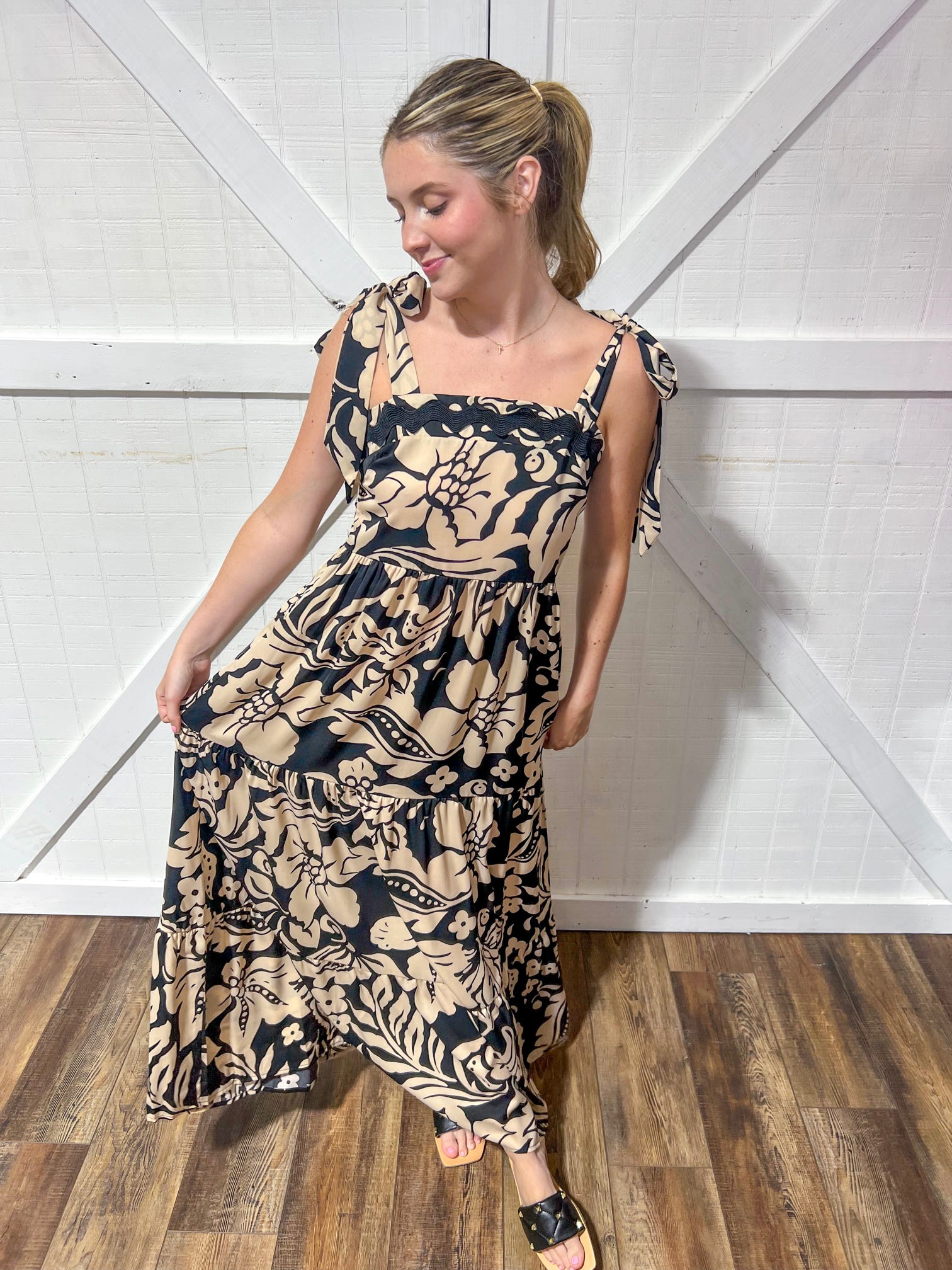 Black and beige floral print maxi dress that ties at the shoulders