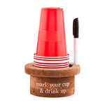 A set of red plastic cups stacked in a wooden holder with a black-and-white marker, on a white background. The wooden base is engraved with the text 'mark your cup & drink up'.