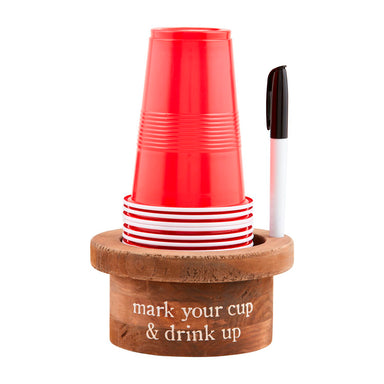A set of red plastic cups stacked in a wooden holder with a black-and-white marker, on a white background. The wooden base is engraved with the text 'mark your cup & drink up'.