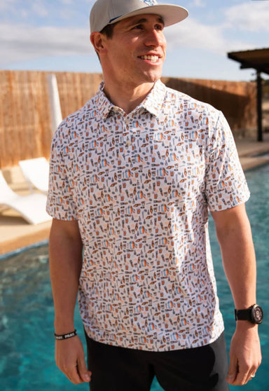 Man modeling our white short sleeve polo featuring a unique all-over print of crawfish boil items