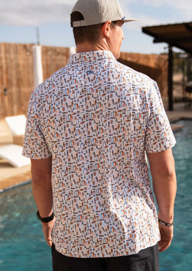 Photo of the back of our white short sleeve polo featuring a unique all-over print of crawfish boil items