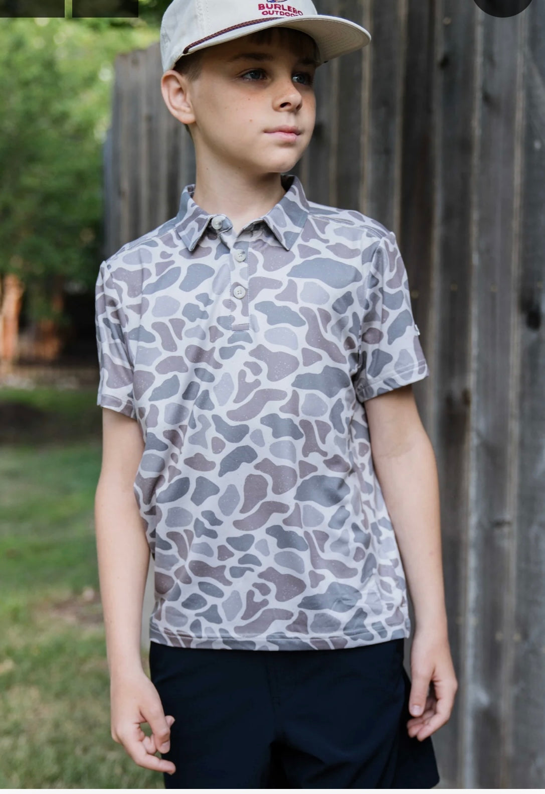 Youth polo in a classic deer camo print