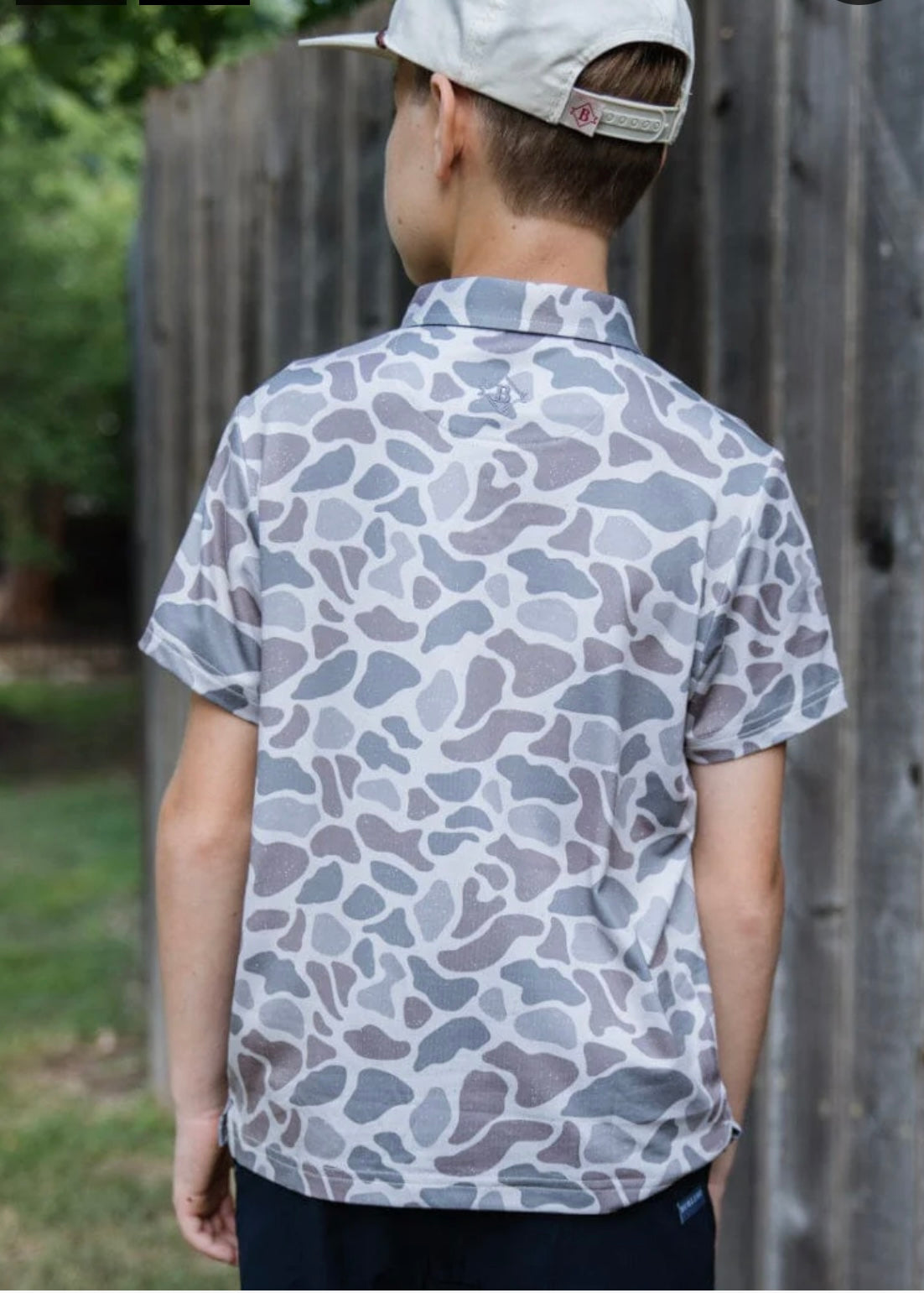 Youth polo in a classic deer camo print