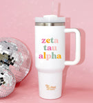 40 oz tumbler wit h Zeta Tau Alpha on it in a light and dark pink, orange, and green