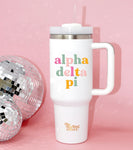 40 oz tumbler with Alpha Delta Pi on it in a light and dark pink, orange, and green