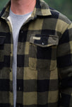 Man modeling a green and black plaid fleece lined shacket