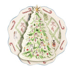 A Christmas-themed ceramic plate featuring a large green Christmas tree with ornaments and a gold star on the front, surrounded by a border of candy canes, bows, holly, and nutcracker illustrations.