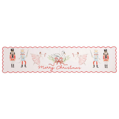 A rectangular holiday table runner with a scalloped red border, featuring watercolor illustrations of nutcrackers, ballerinas, a swan, candy canes, and the text 'Merry Christmas' on a white background.