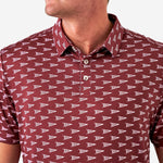 Up close photo of a maroon short sleeve polo with white pennants saying Howdy against a white background