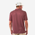 Photo of the back of a maroon short sleeve polo with white pennants saying Howdy against a white background