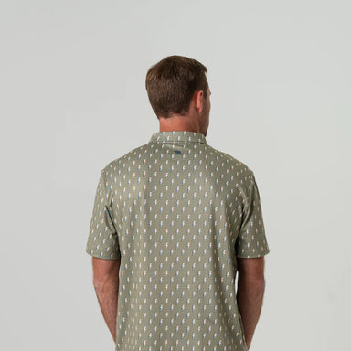 Man modeling the back of a sage green short sleeve polo with a small lightning rod pattern all over