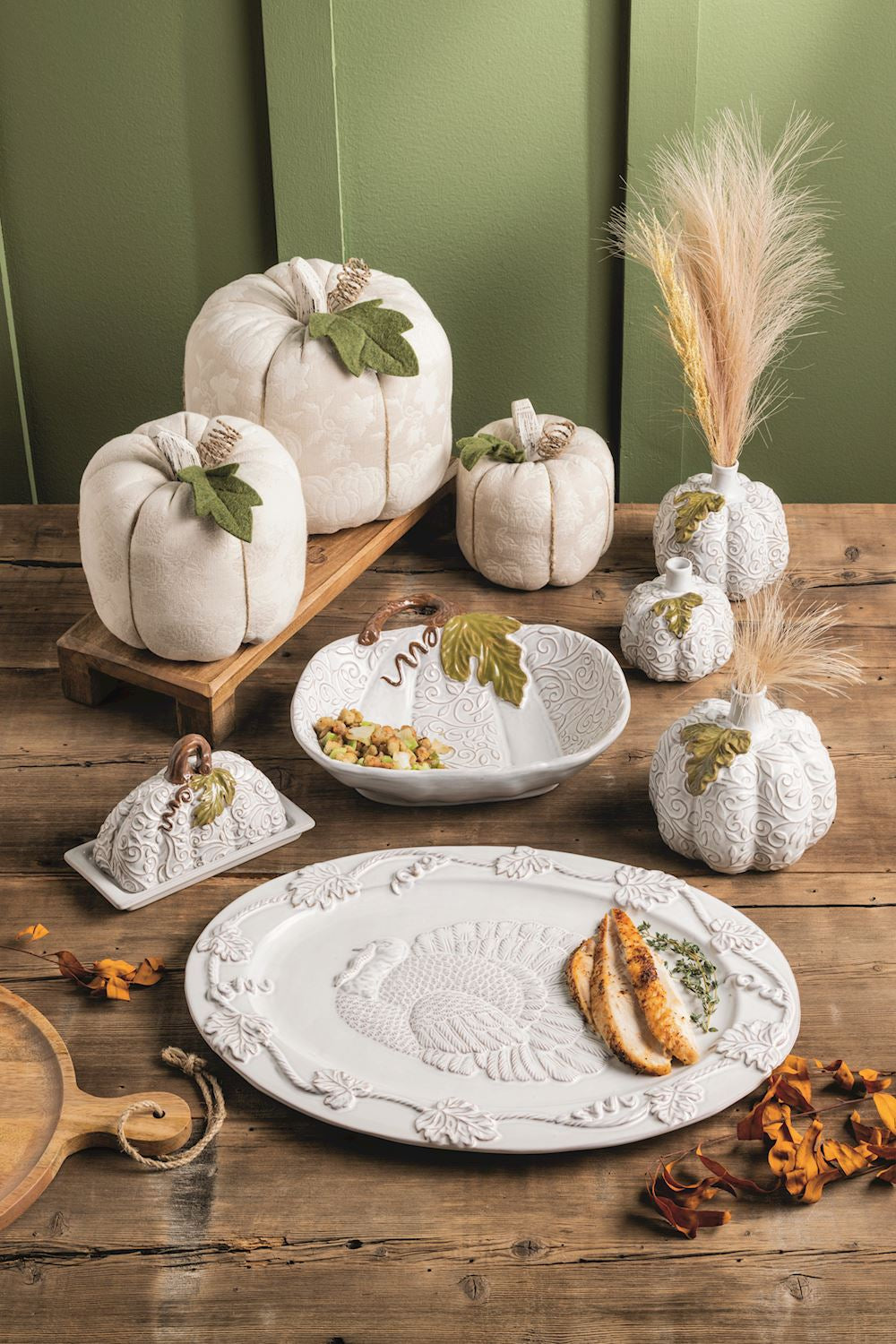 Stoneware butter dish features pumpkin lid with pressed lace detail and hand-painted stem and leaf.