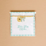 Gold bead bracelet with Zeta Tau Alpha charm and a turqouise bow charm