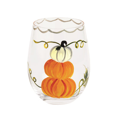 Clear stemless wine glass with painted pumpkins on a white background