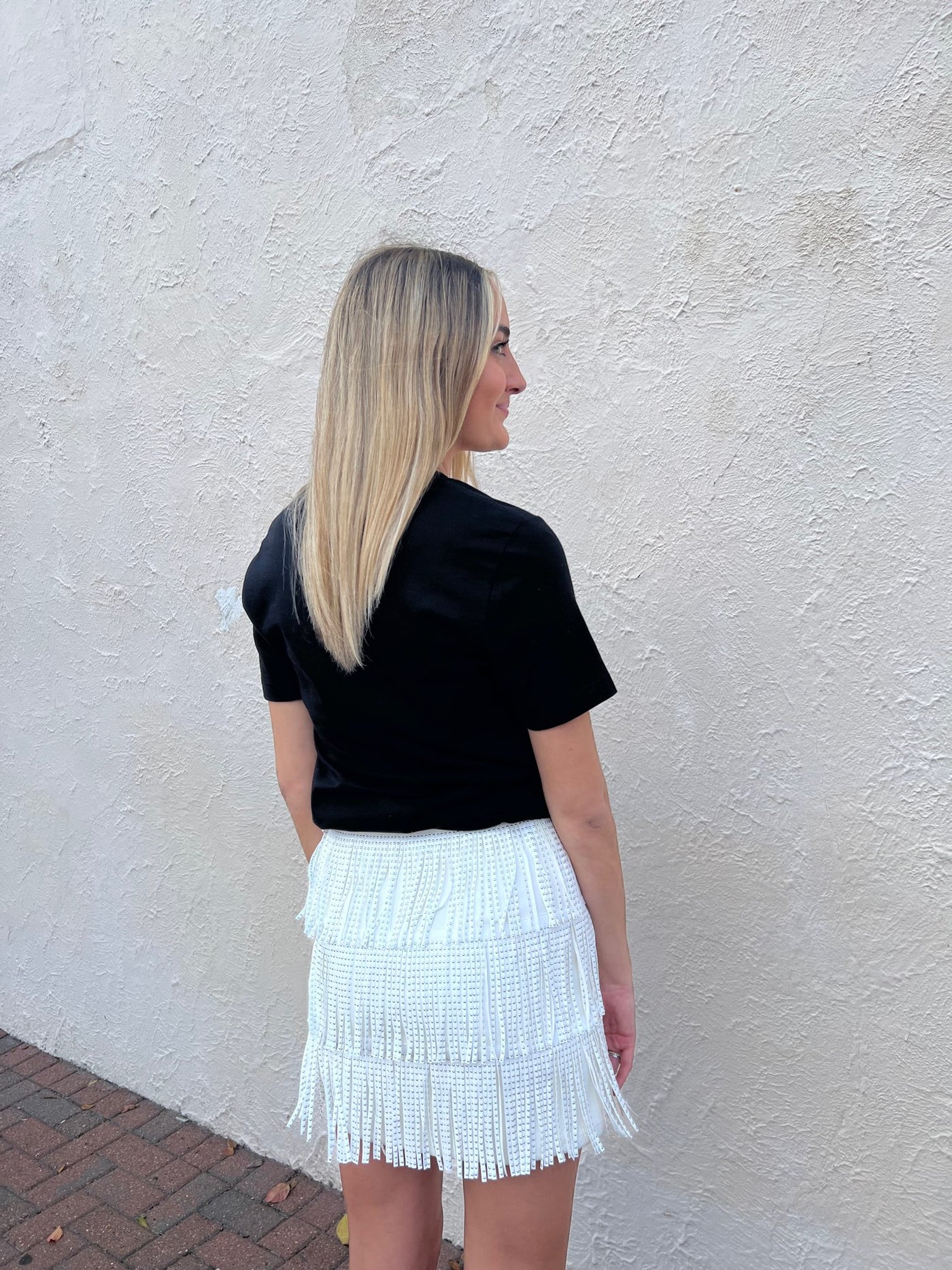 White faux leather fringe mini skirt