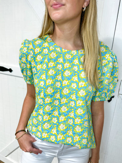 Cotton top with relaxed bubble sleeve and available in turquoise/ yellow or purple/ yellow